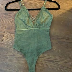 Green lacy thong bodysuit.